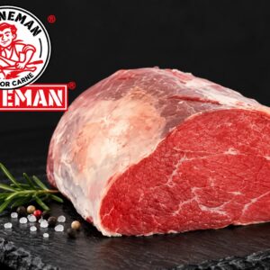 Un trozo de picaña de ternera, adornada con ajetes